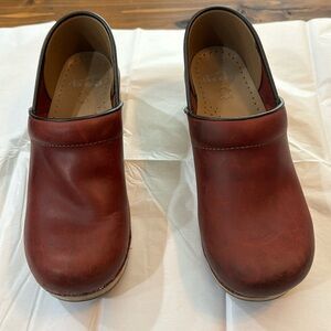 Red Dansko’s size 39, reserved for healing beauty